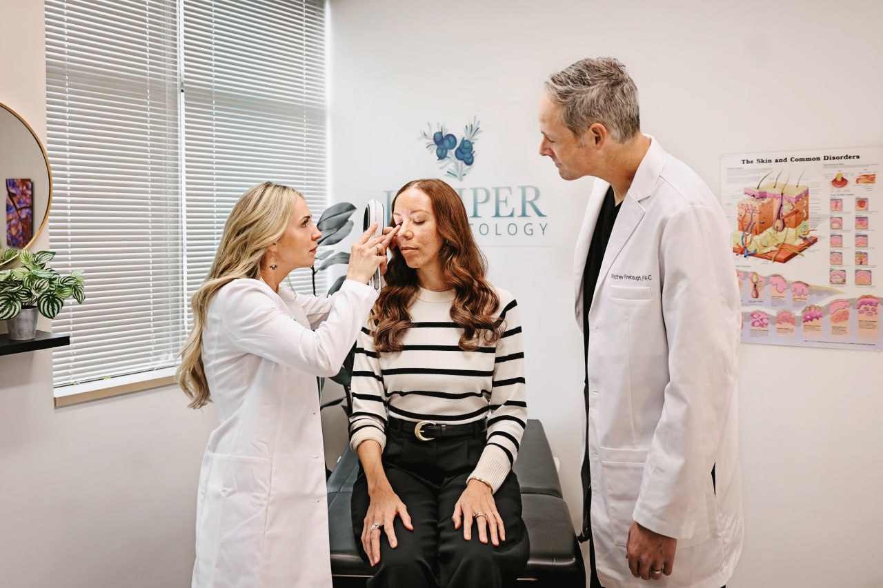 Dermatologist examining a patient's facial melasma at Juniper Dermatology in Bend, Oregon
