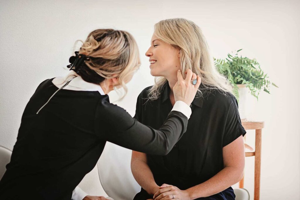 Dermatologist examining patient's skin in Bend, Oregon.