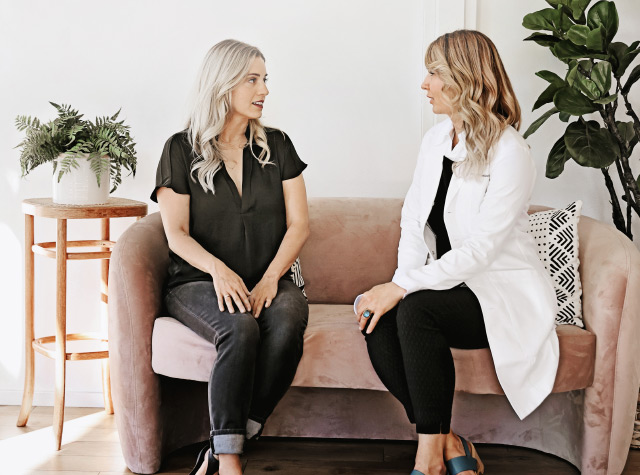 Dermatologist discussing skin cancer and melanoma treatment with a patient in Bend, Oregon